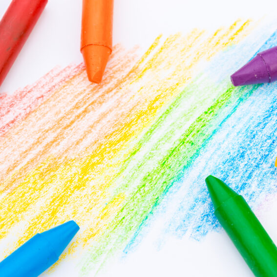 Crayons on a coloring page.